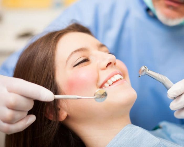 Dentist Doing A Dental Treatment — Advanced Dental Southern Highlands In Moss Vale, NSW