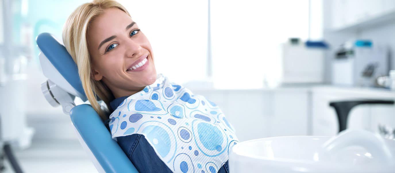 Smiling And Satisfied Patient In Dental Office Chair — Advanced Dental Southern Highlands In Moss Vale, NSW