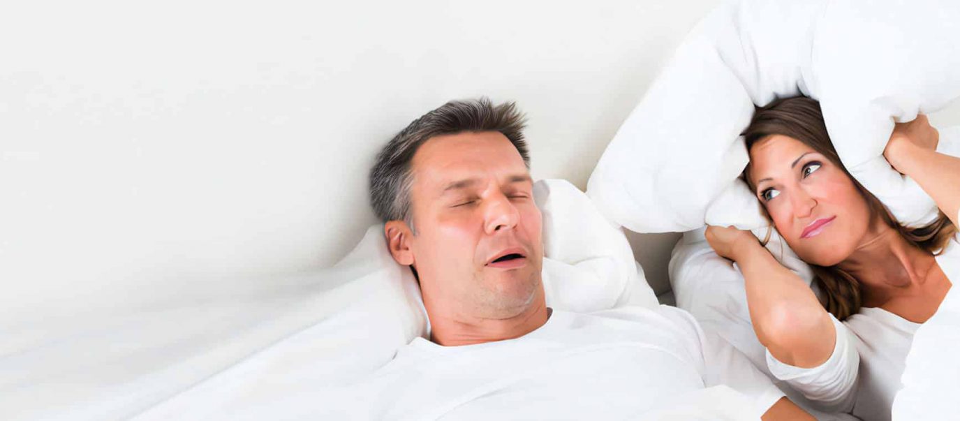 Snoring Man Sleeping With Apnoea And His Wife — Advanced Dental Southern Highlands In Moss Vale, NSW