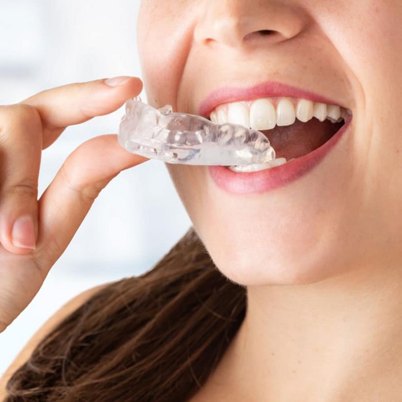 Woman Wearing Custom Made Mouthguard — Advanced Dental Southern Highlands In Moss Vale, NSW